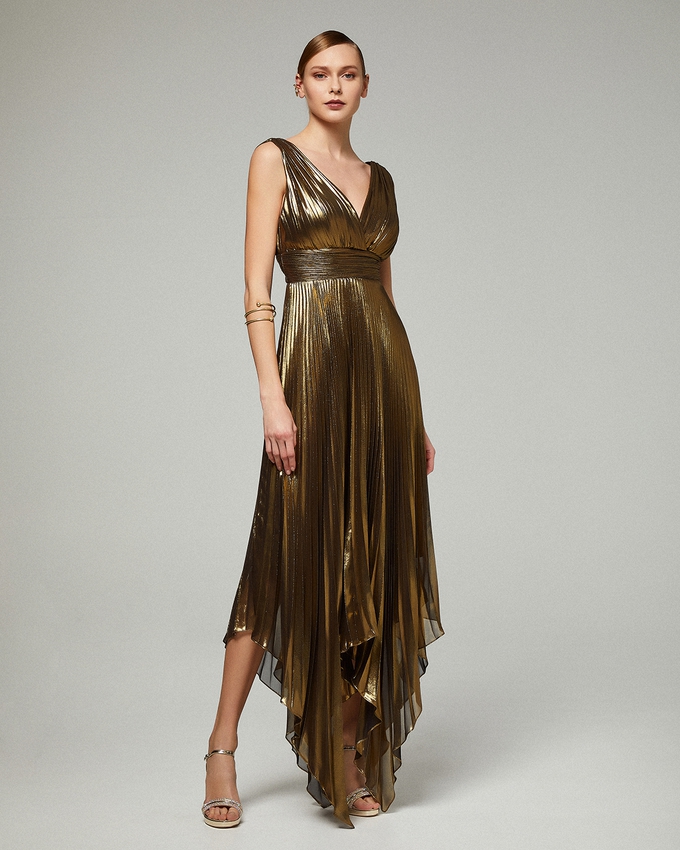 Evening asymmetrical pleated dress with shining fabric