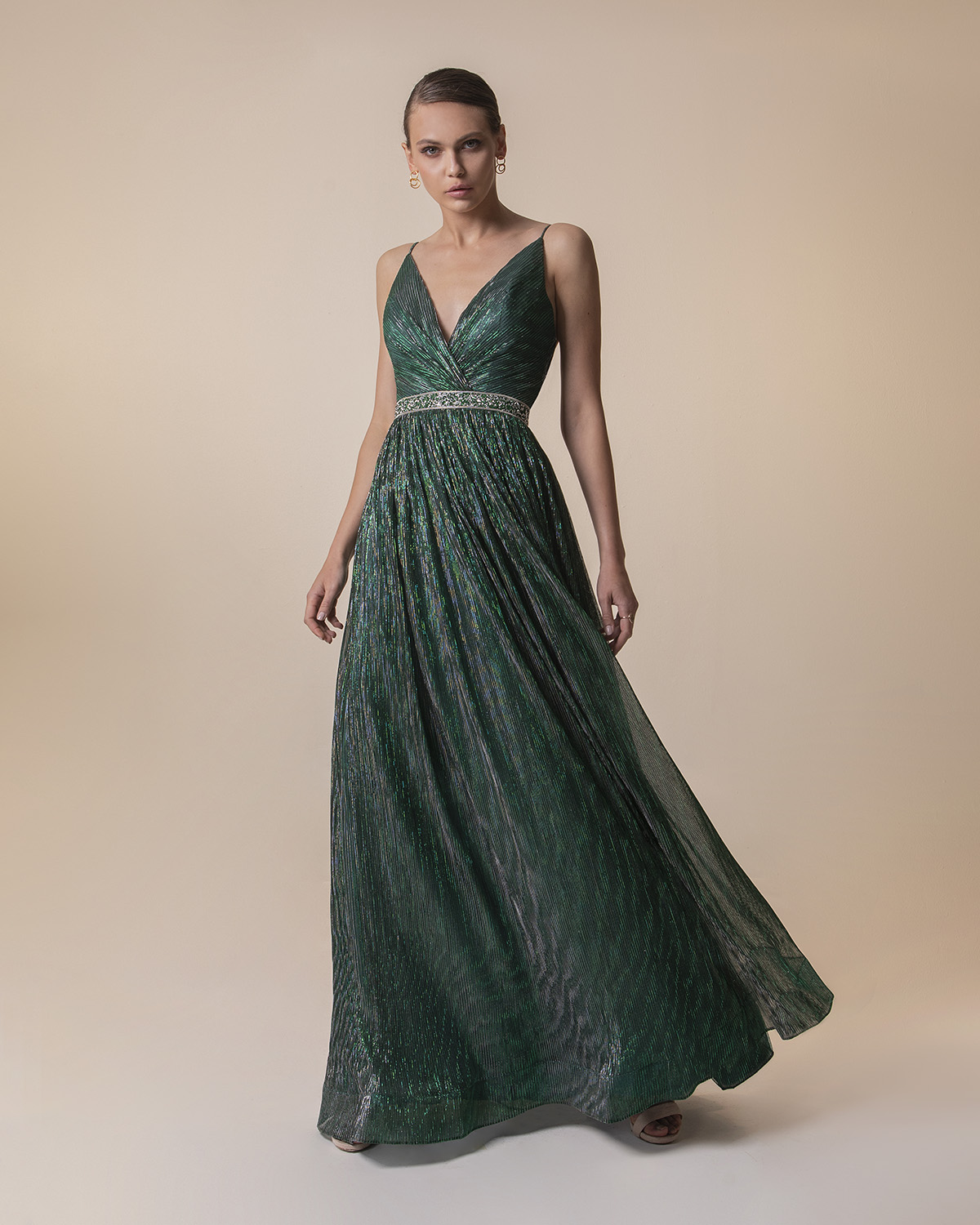 Evening Dresses / Long pleated evening dress with shining fabric and beading around the waist