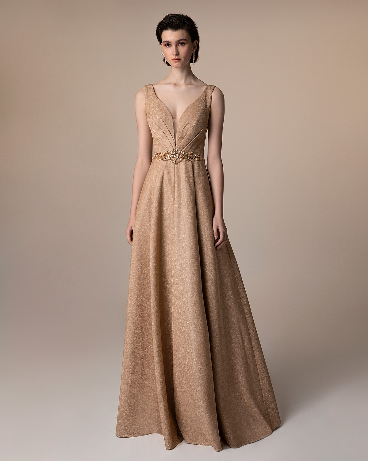 Evening Dresses / Long evening dress with shining fabric and beaded waist