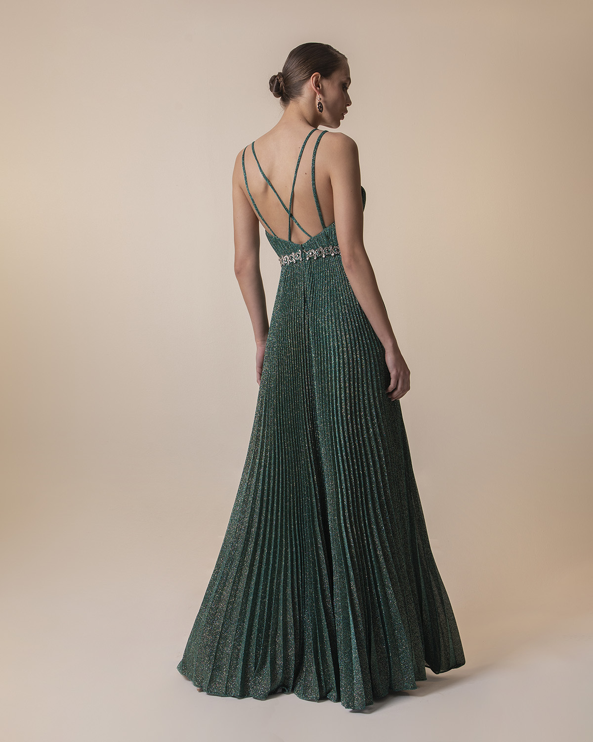 Evening Dresses / Long pleated evening dress with shining fabric and beading around the waist