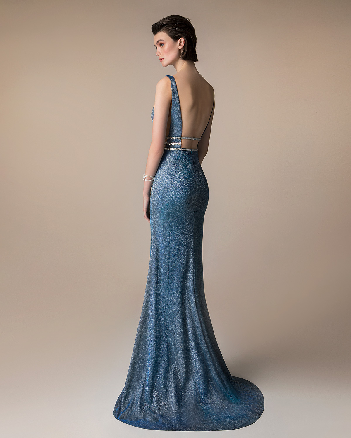 Evening Dresses / Long evening  dress with shining fabric,  beaded waist and open back