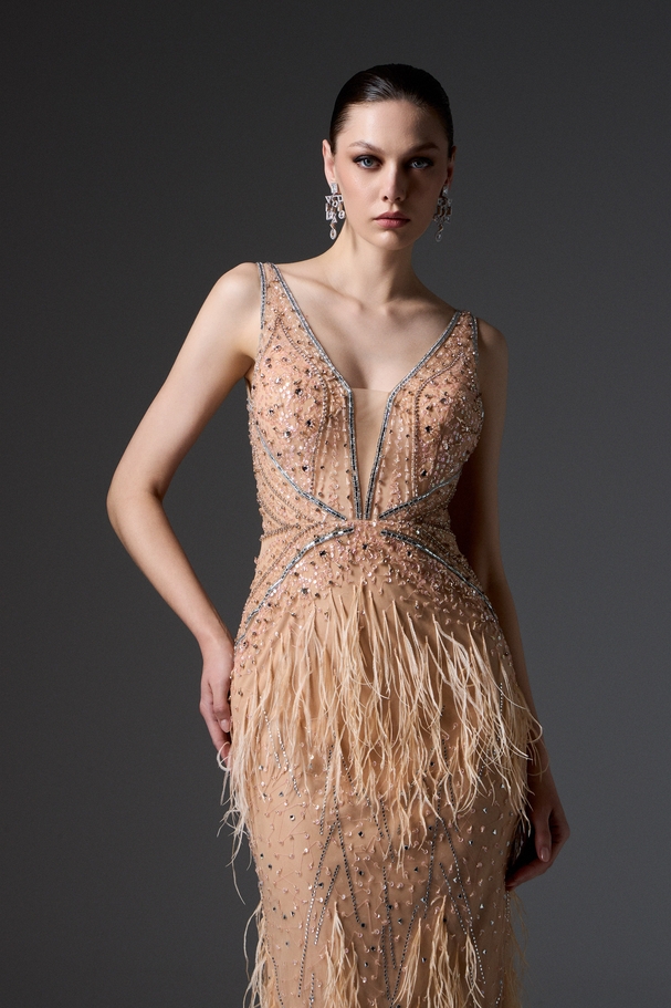 Evening long fully embroidered dress with feathers