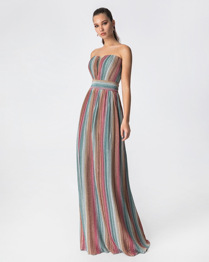 Long cocktail pleated strapless dress with shining fabric