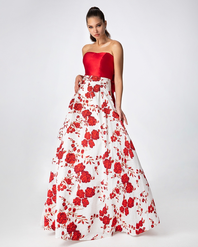 Long printed brocade skirt with solid color top and big bow in the back