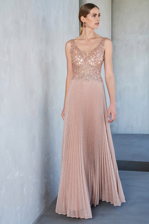 Long evening pleated dress with shining fabric and beaded top