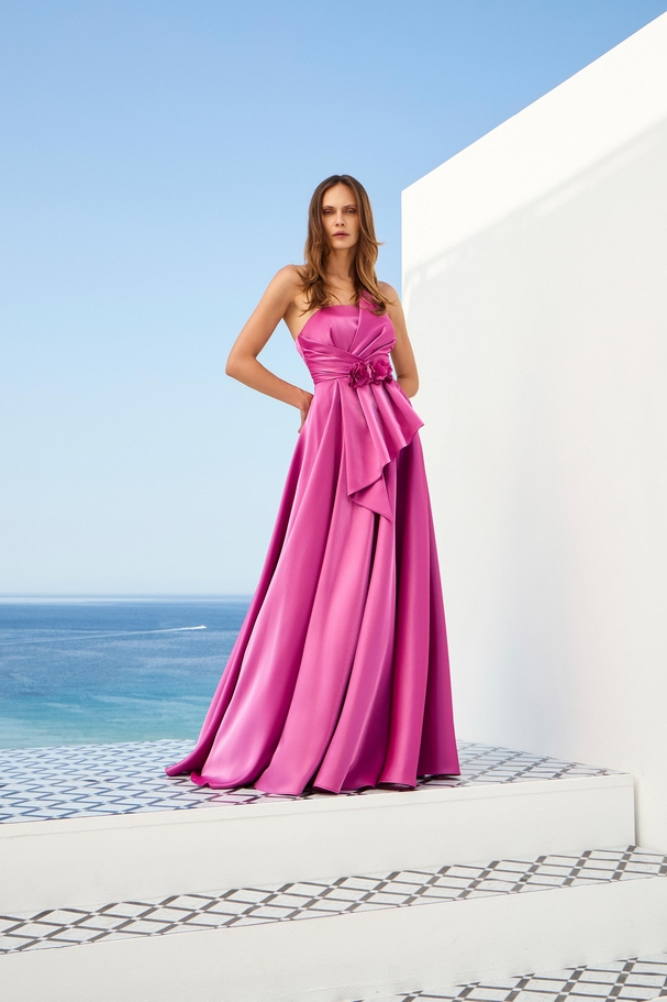 Satin strapless dress with flowers, draping and slit