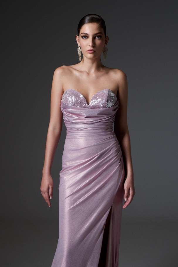 Evening long dress made of shiny fabric with fully embroidered sequin top