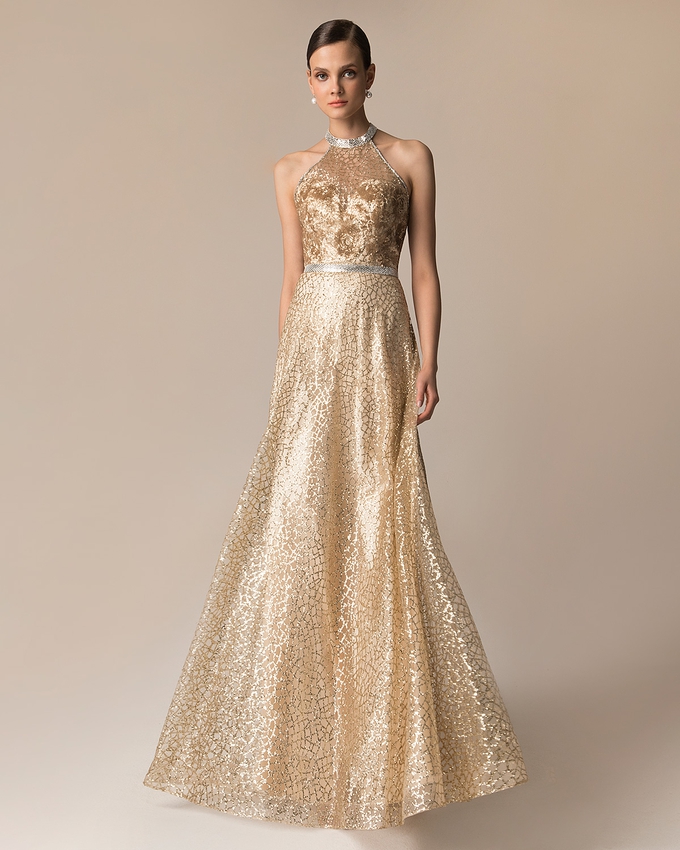 Long evening fully beaded dress with shining fabric and open back