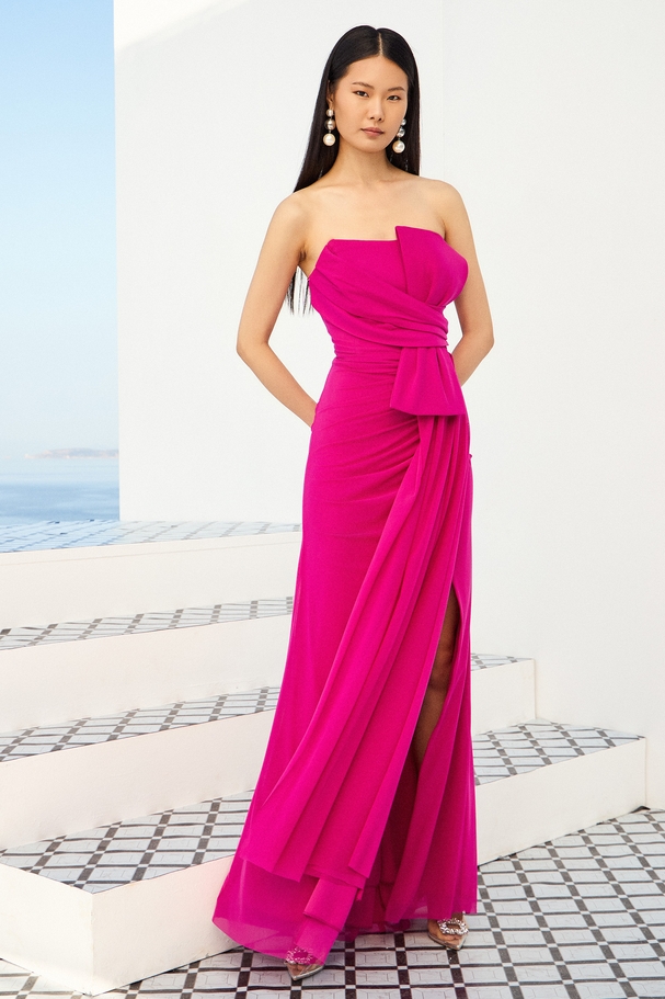 Strapless cocktail dress in stretch tulle with bow and draped bodice.