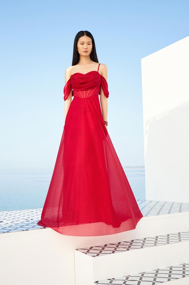 Cocktail dress with crystal shimmer fabric and draped details.