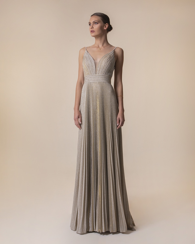 Long evening pleated dress with shining fabric