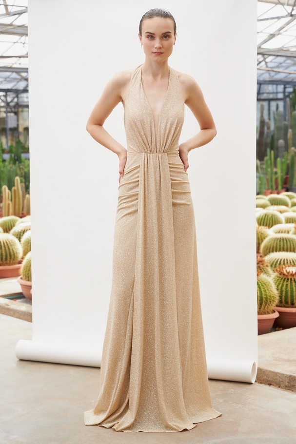 Long evening dress with shining fabric and open back