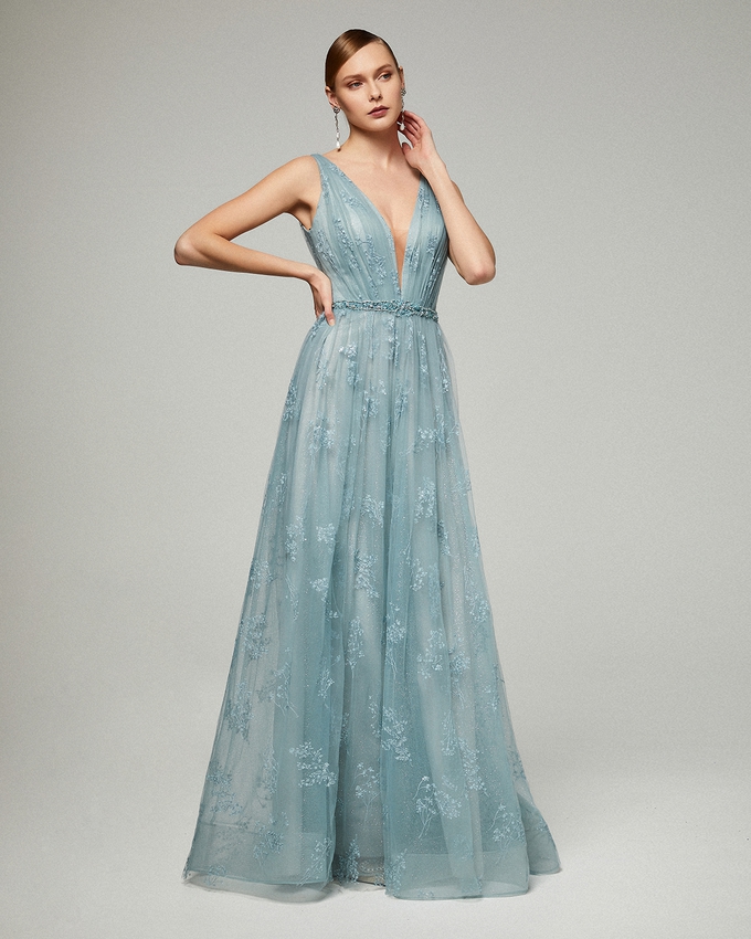 Long evening tulle dress with beading around the waist