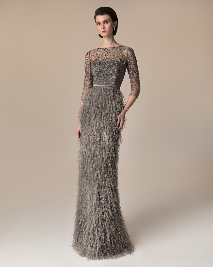 Long evening dress with skirt of feathers and gully beaded top