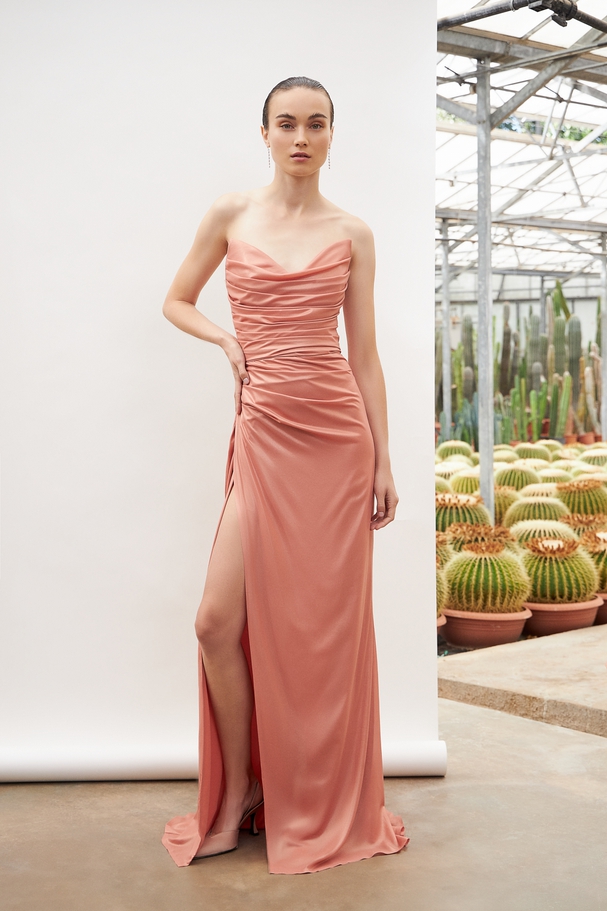 Long cocktail straples dress with shining fabric and opening