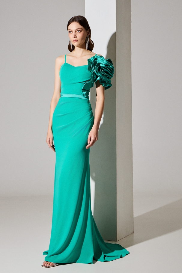 Evening long crepe dress with one shoulder, satin flower on the shoulder, and satin belt at the waist