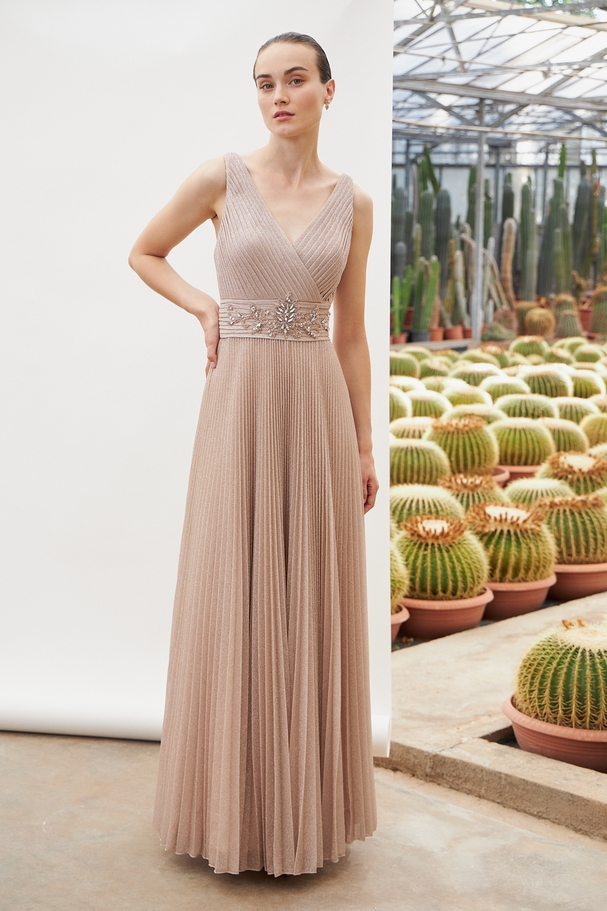 Long evening dress with shining fabric, wide straps and beading at the waist