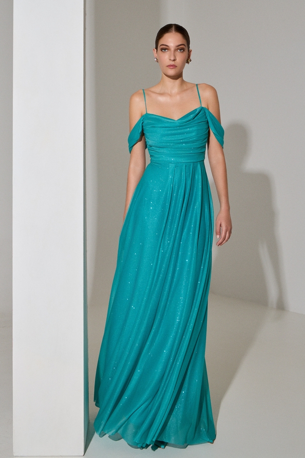 Evening long dress with low sleeves made of shiny fabric