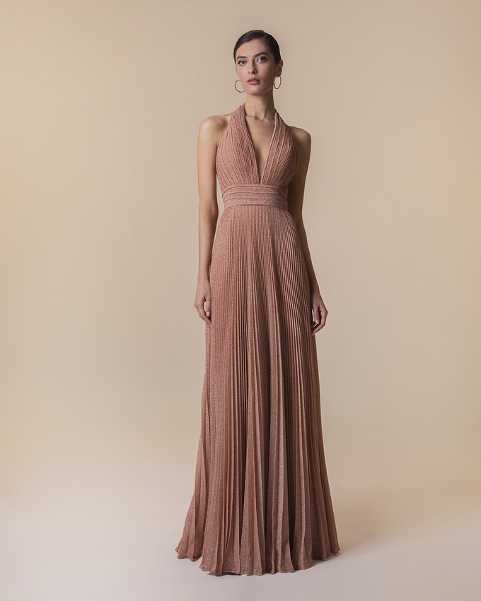 Long pleated evening dress with shining fabric and open back