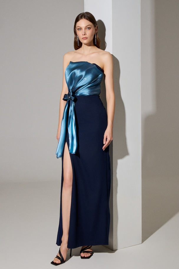 Evening long strapless crepe dress with a slit, large organza bow with embroidery