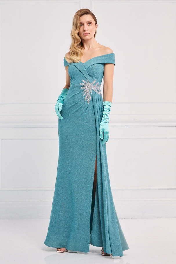 Evening long mermaid dress made of shiny fabric with embroidery on the side and off-the-shoulder design