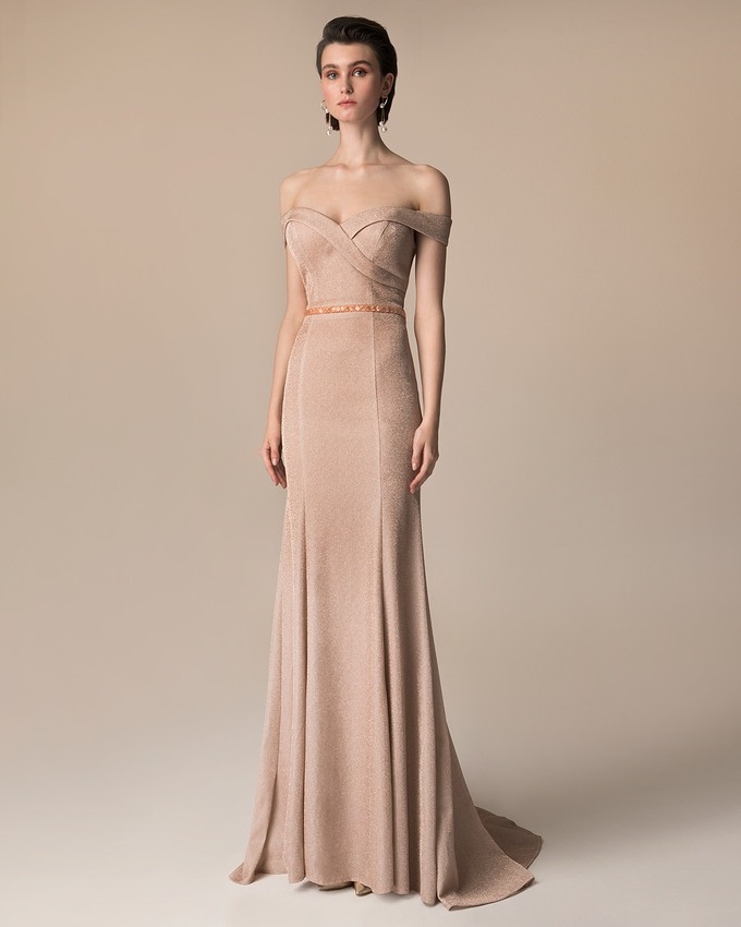 Long evening dress with beaded belt and shining fabric