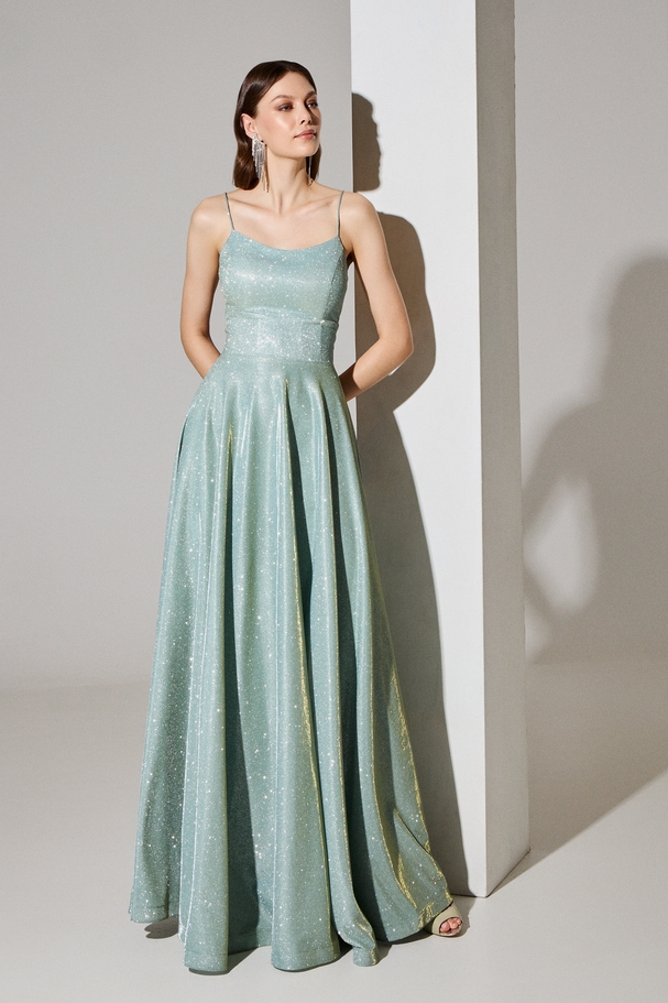Evening long dress made of shiny fabric, backless