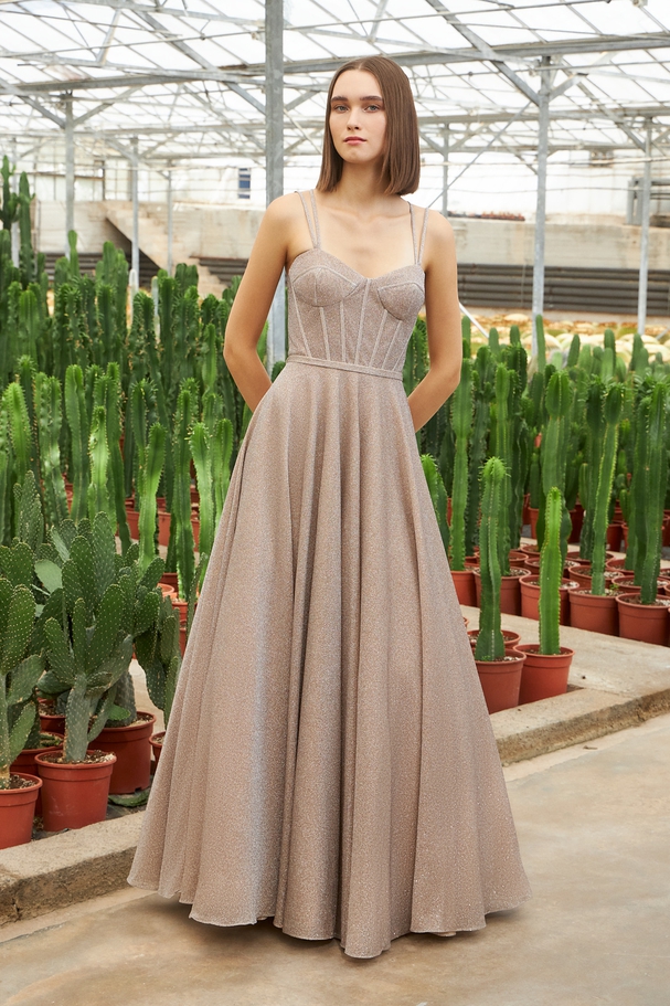 Long evening dress with shining fabric, open back and straps