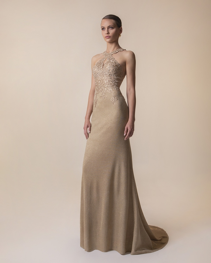 Long evening dress with shining fabric and fully beaded top