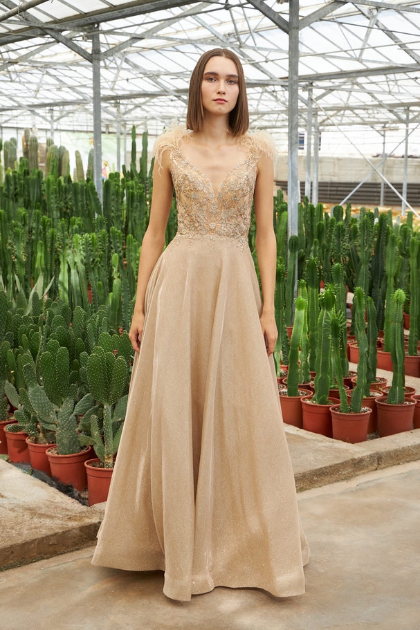 Long evening dress with shining fabric and beaded top