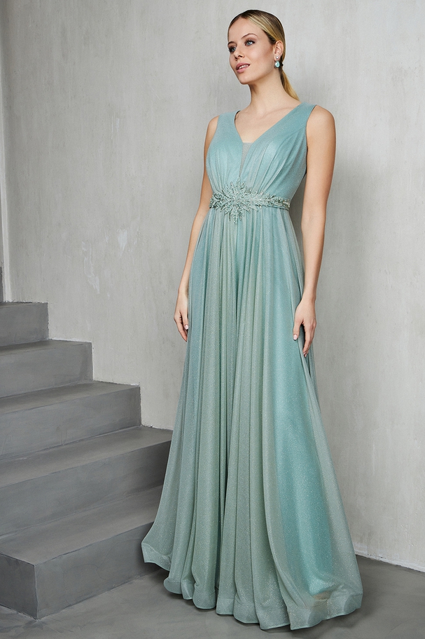 Long evening shining dress with beading at the waist and wide straps