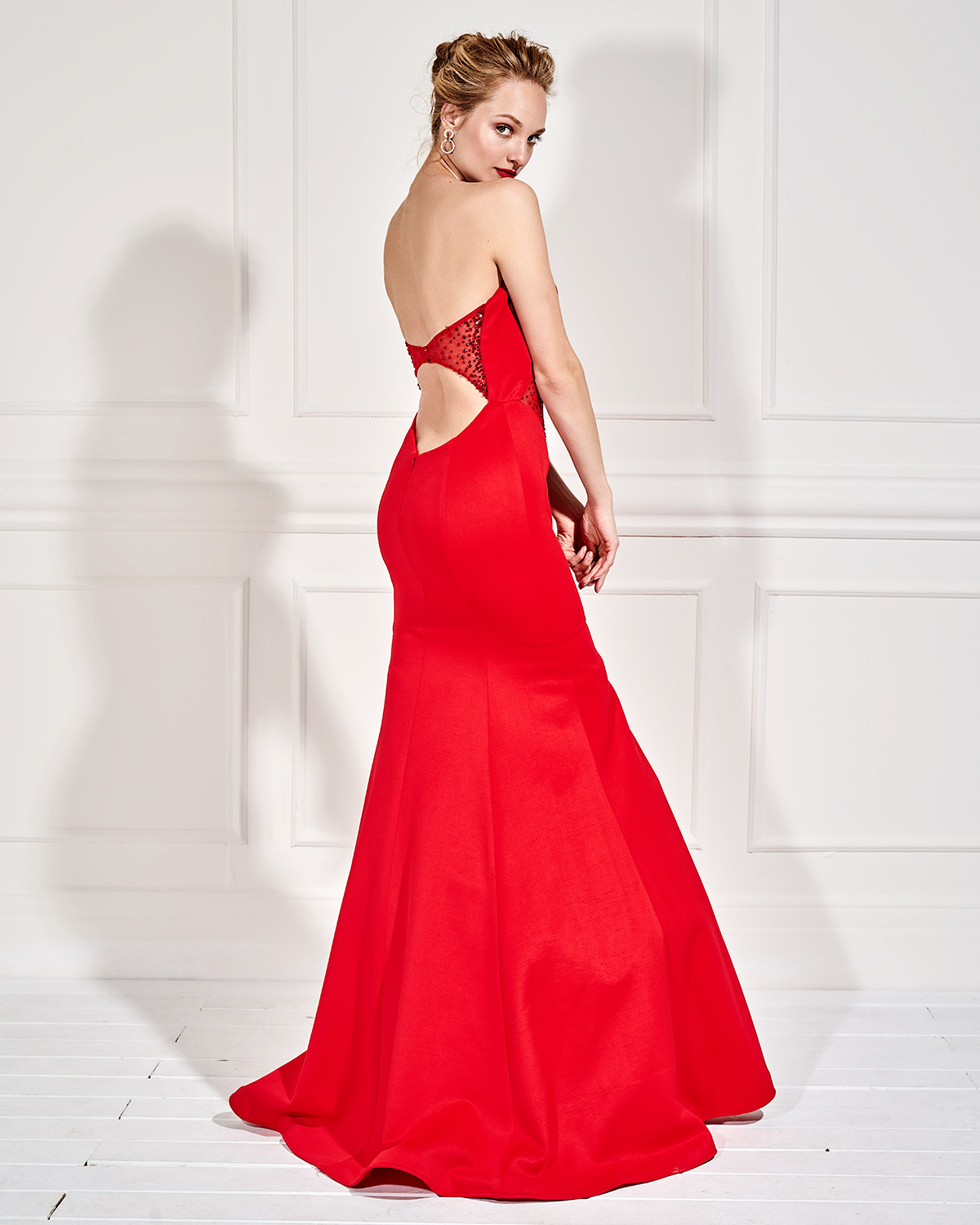 Long strapless evening dress with open back and beading