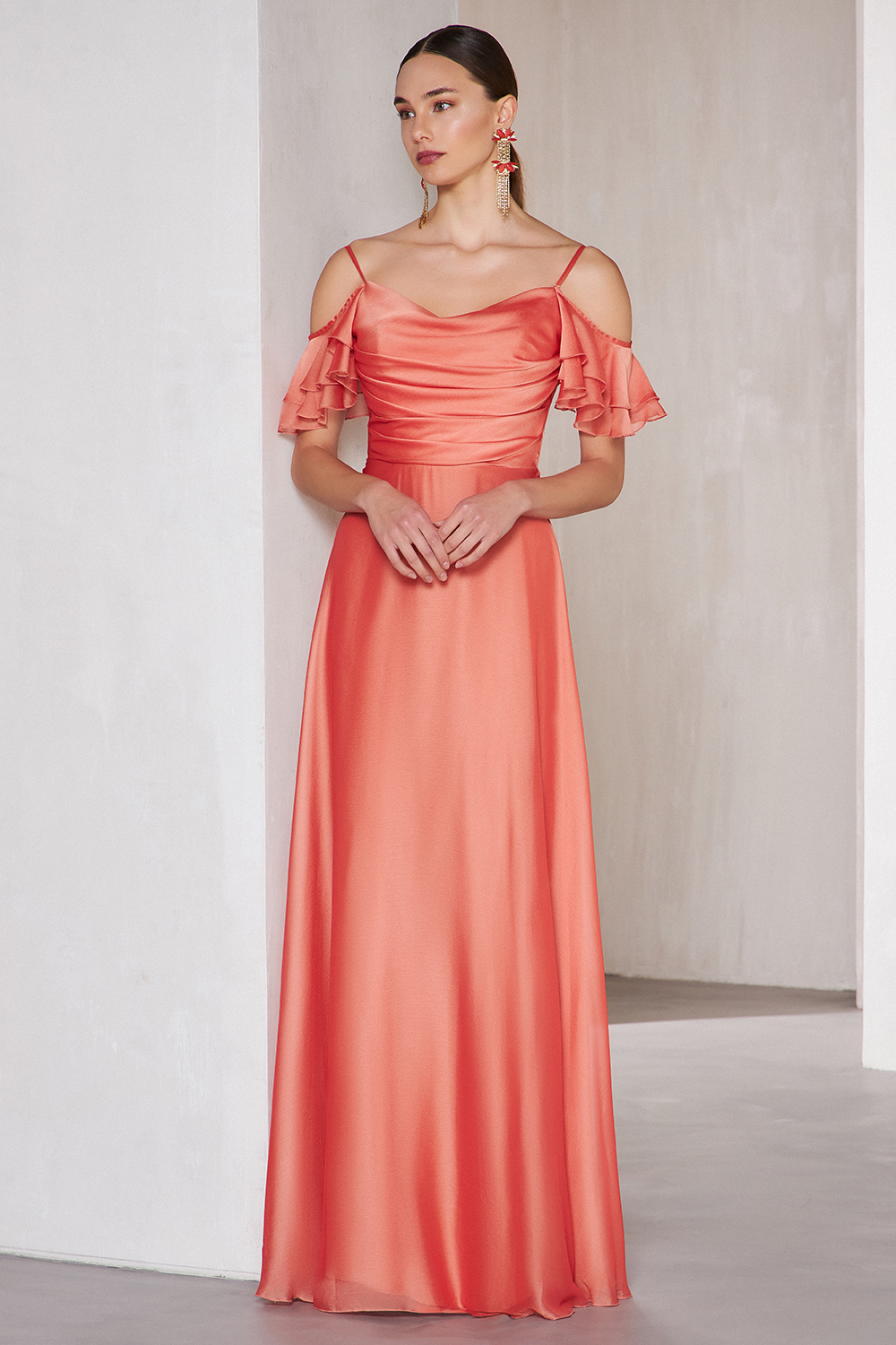Long cocktail dress with shining fabric and sleeves