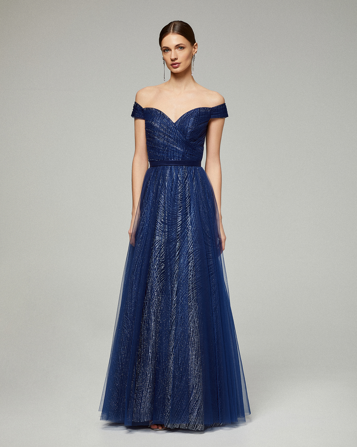 Long evening dress with shining tulle fabric