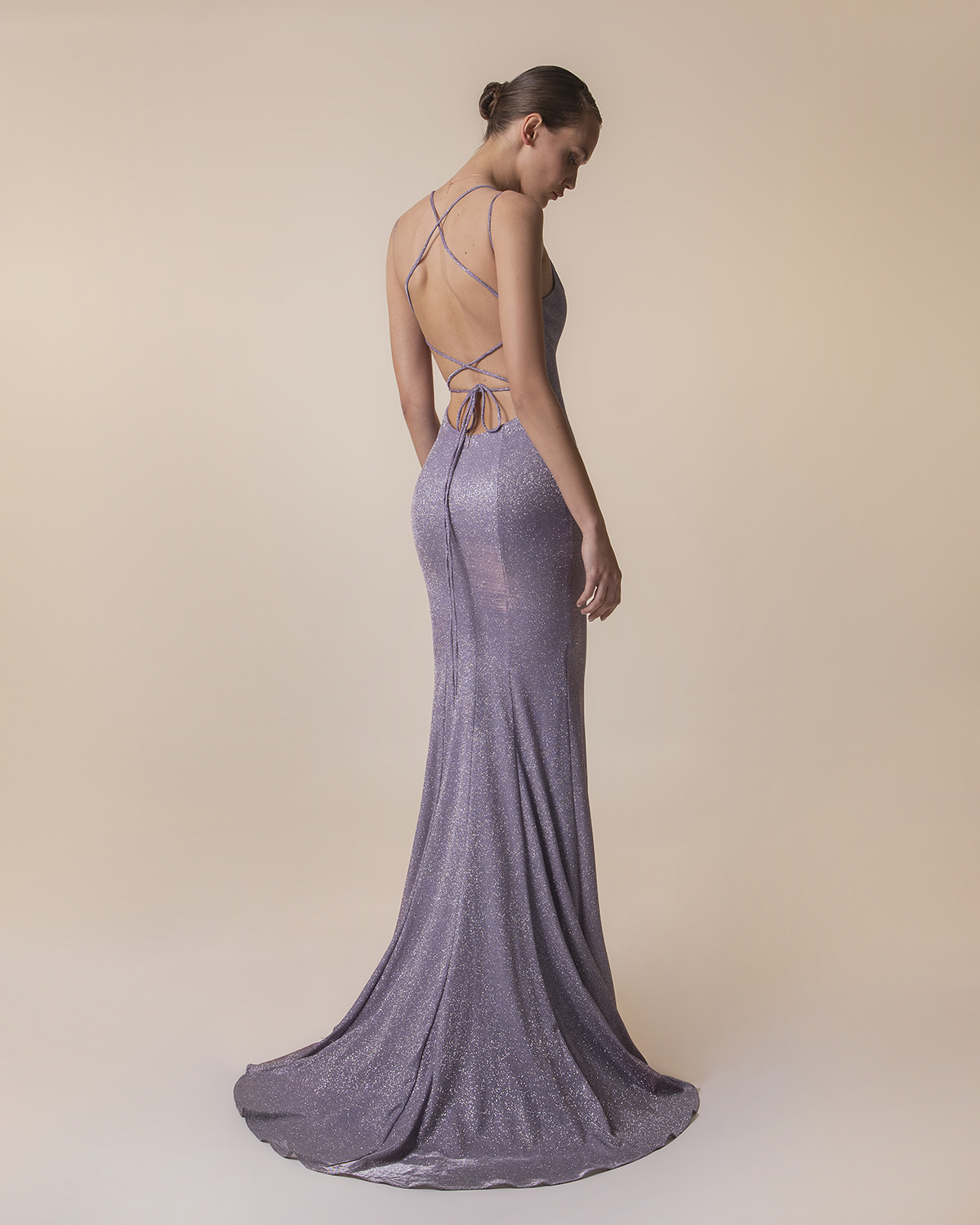 Long evening dress with shining fabric and open back
