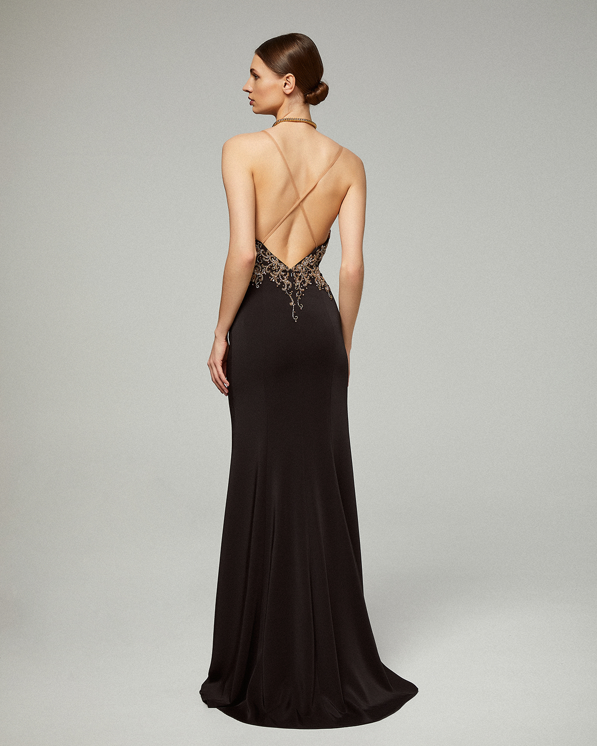 Long evening dress with beading on the top and open back