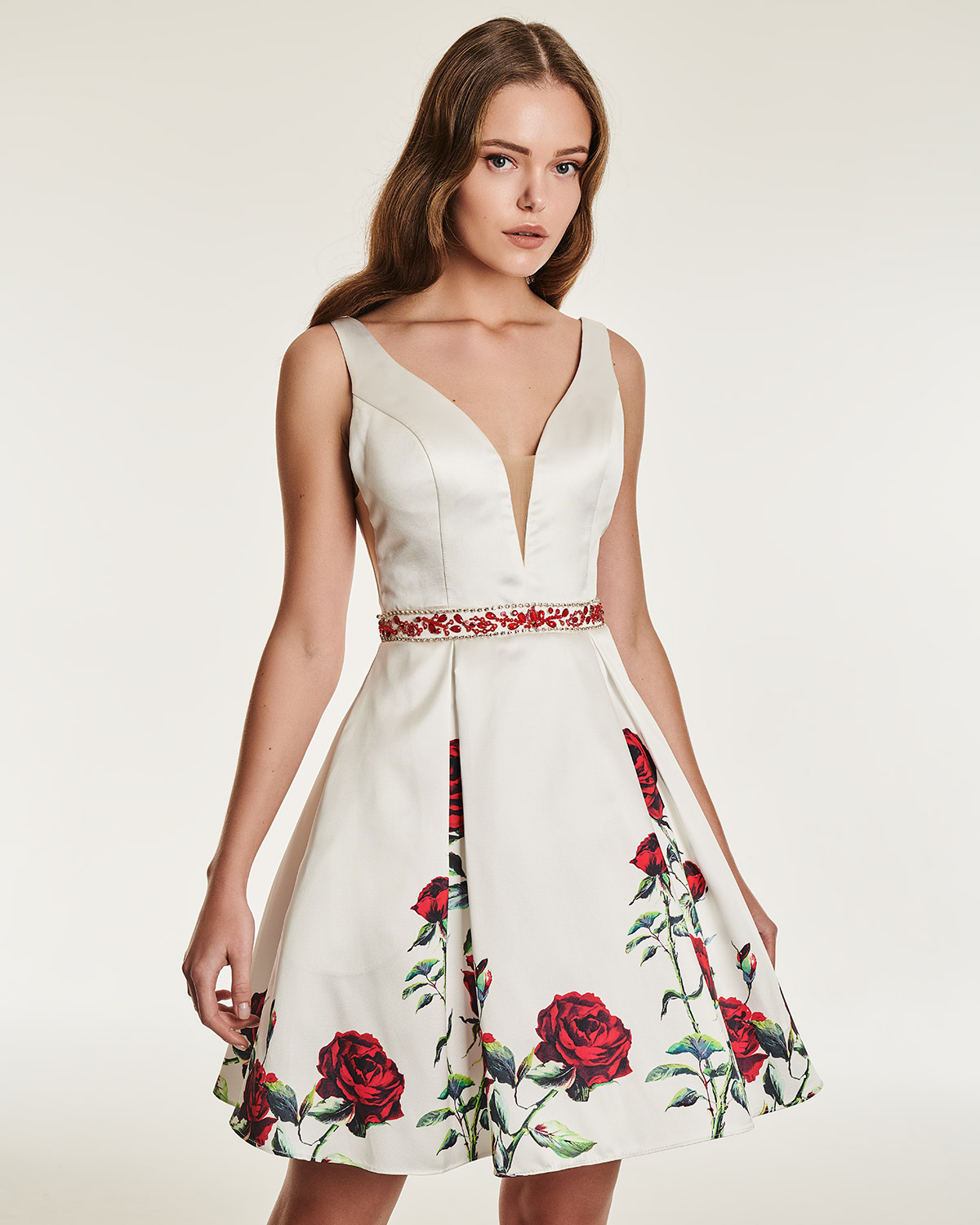 Cocktail dress with floral motif and beading on the waistbund