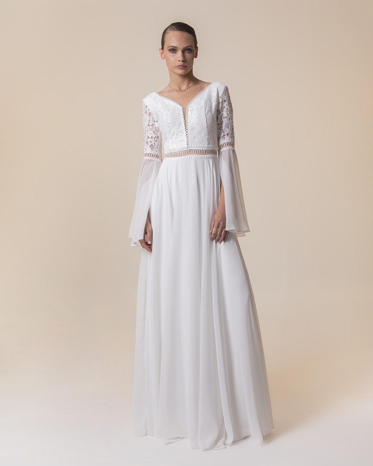 Long wedding dress with long sleeves and lace on the top
