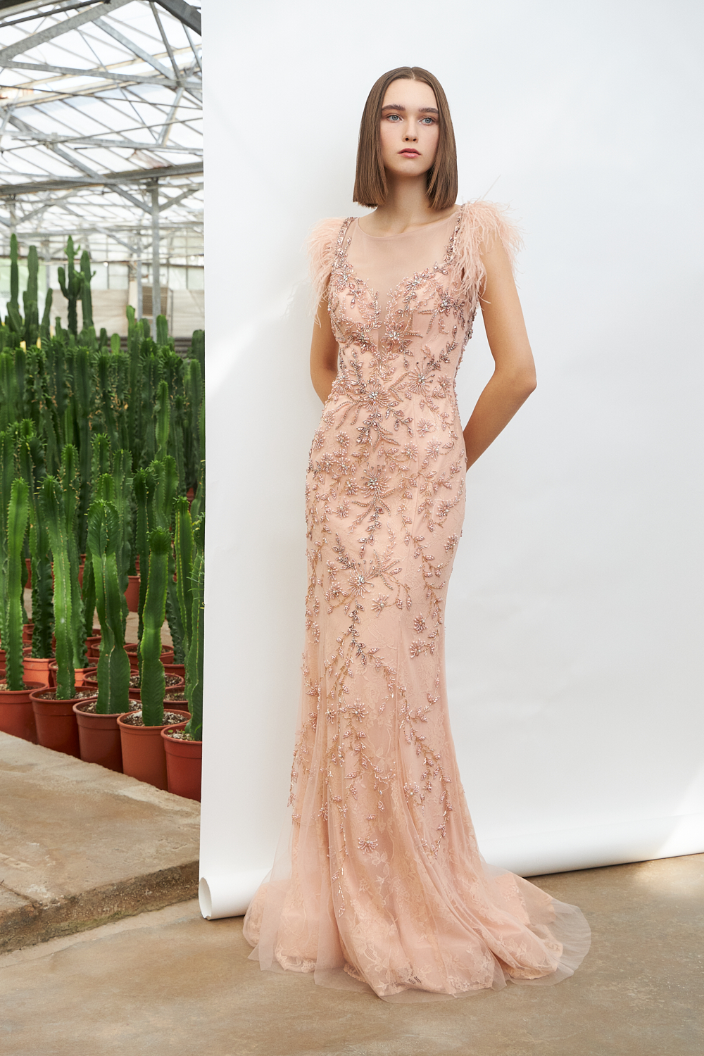 Evening Dresses / Long evening fully beaded dress with feathers at the sleeves
