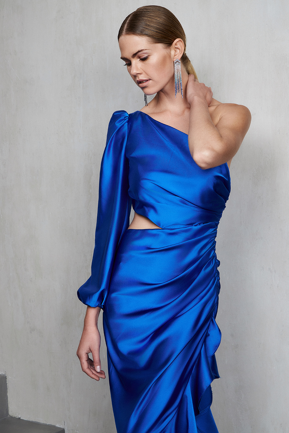 One shoulder asymmetrical satin dress with one long sleeve and opening